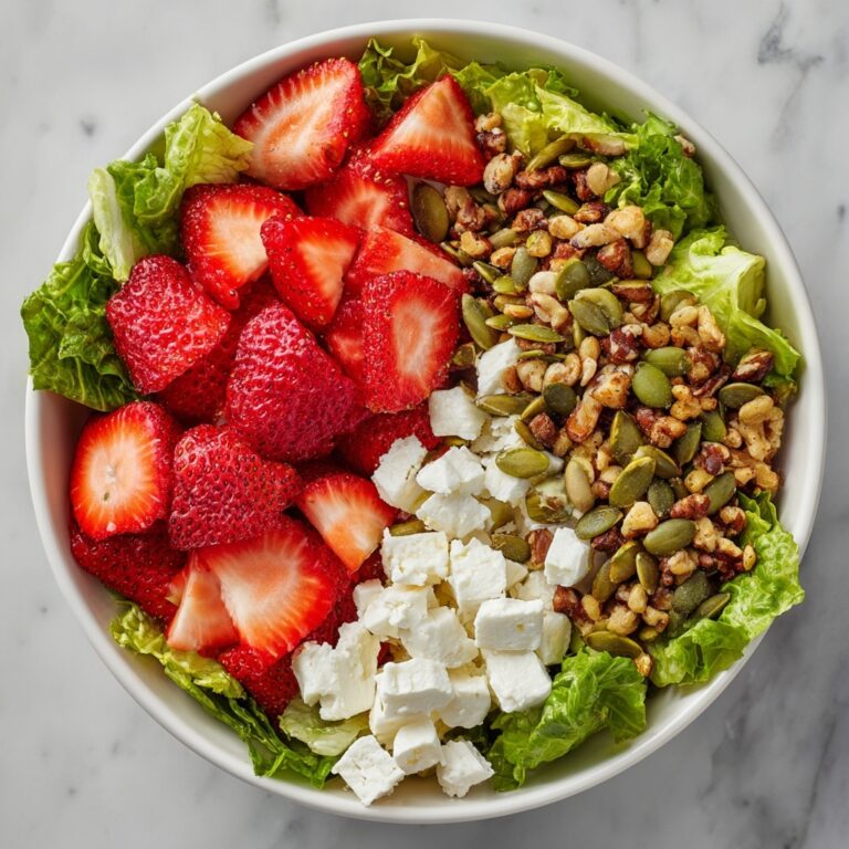 Strawberry Arugula Salad with Candied Almonds, Goat Cheese, and Champagne Vinaigrette Recipe